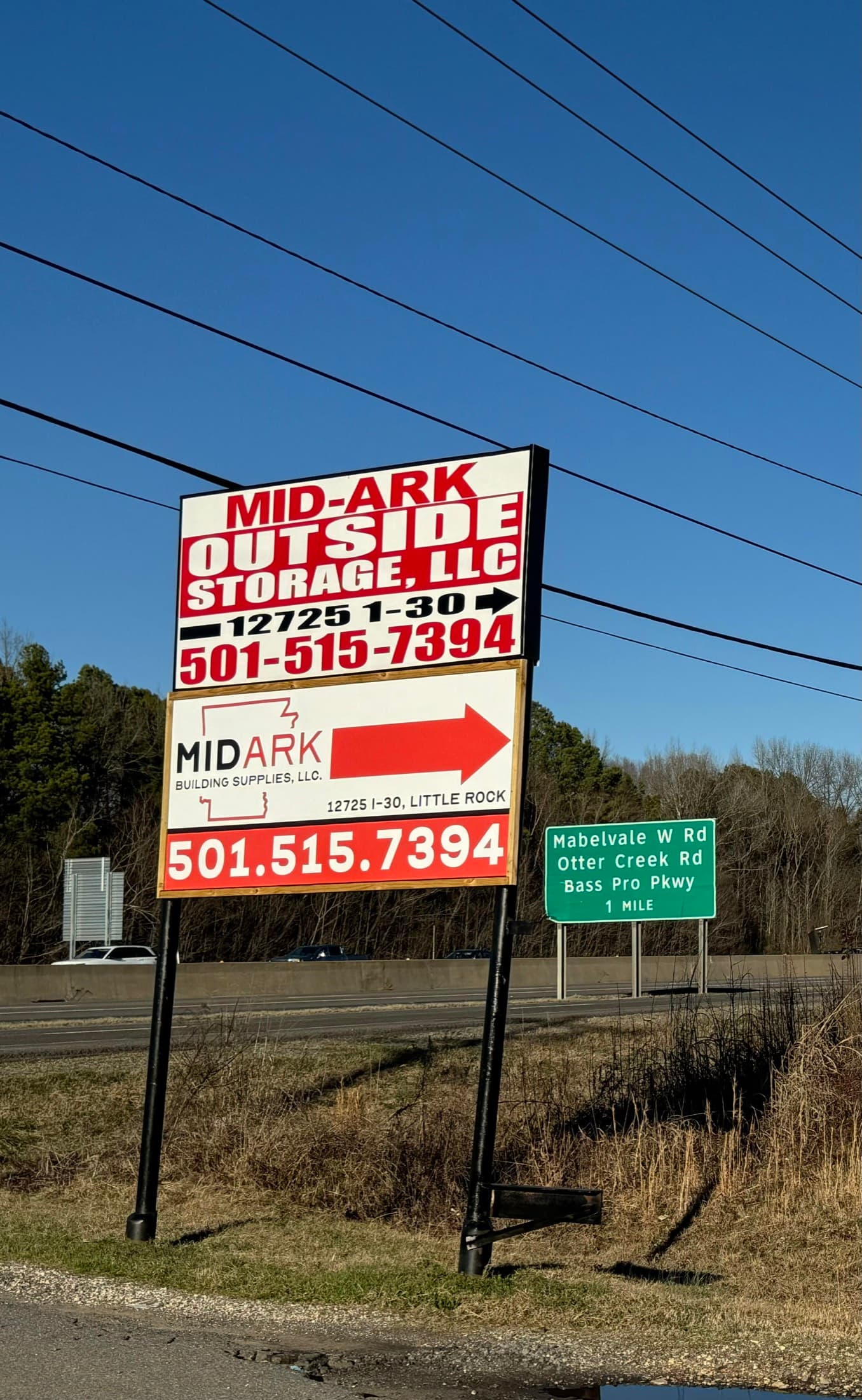 The MidArk Outside Storage road sign visible from I-30